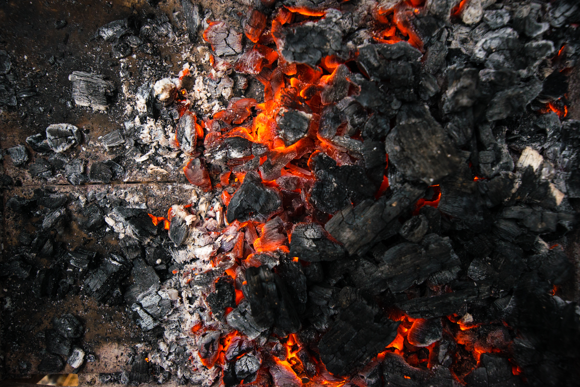 Background of burning hot coals. Burning coals in the brazier.