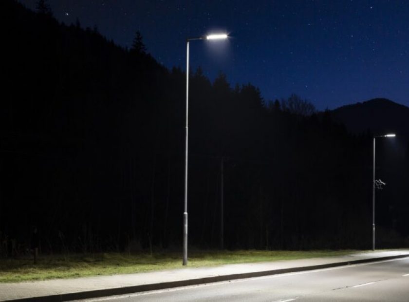 two modern streetlights, LED, empty road